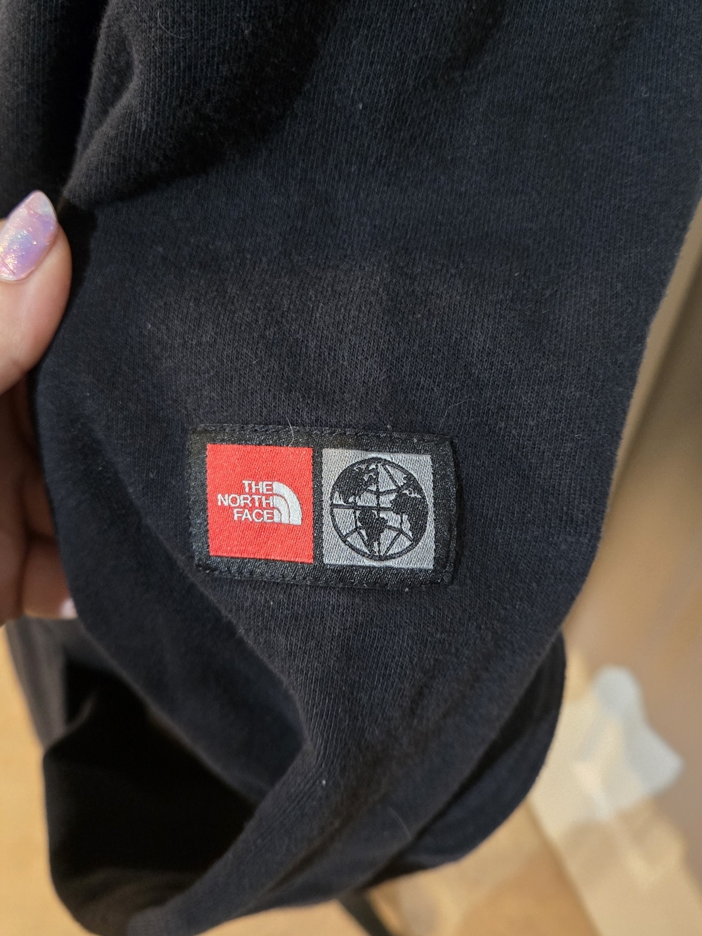 The North Face Black Hoodie with Multicolor Flag Logo and Red Drawcords - Picture 2 of 4